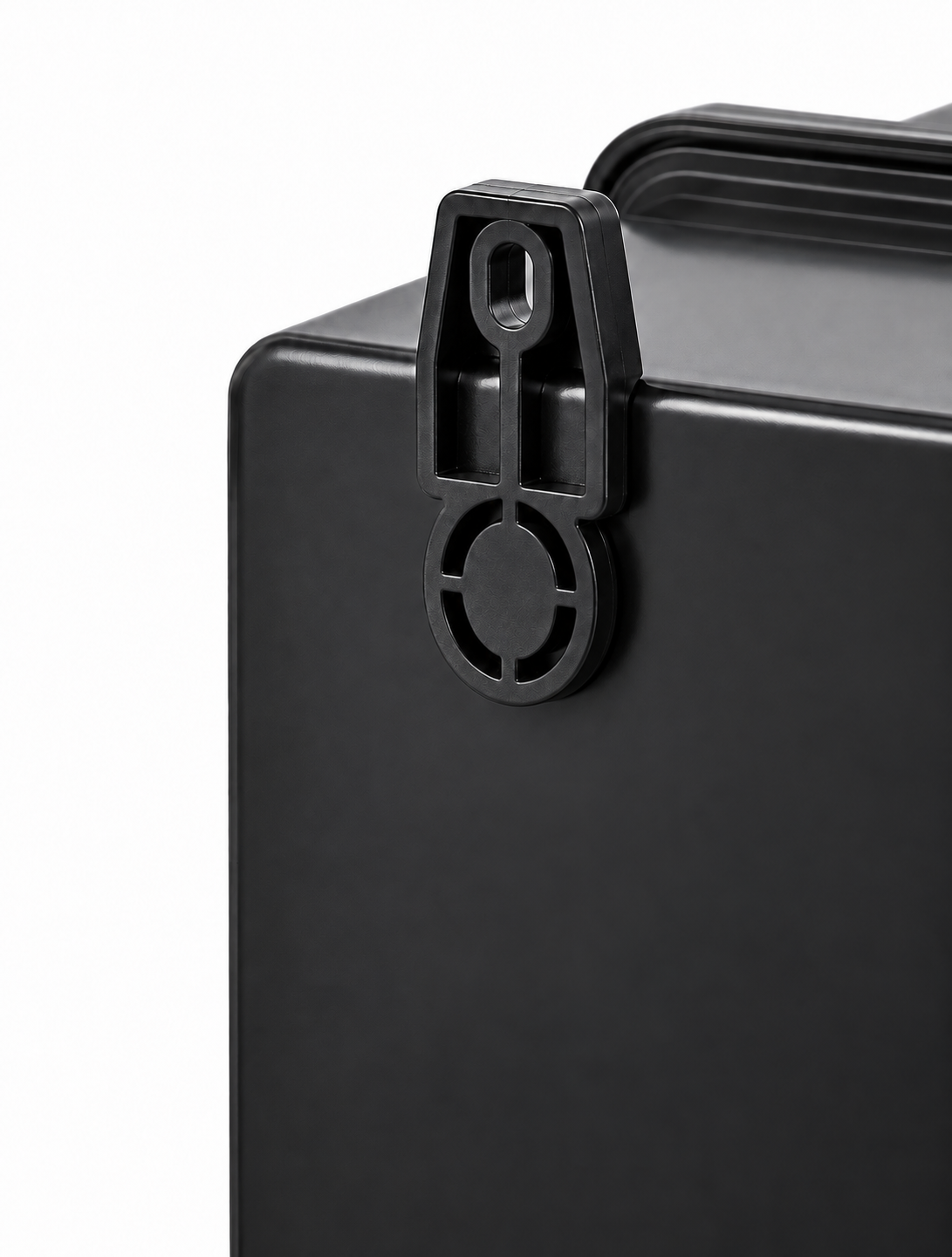 Close-up of the black molded latch on the enclosure edge